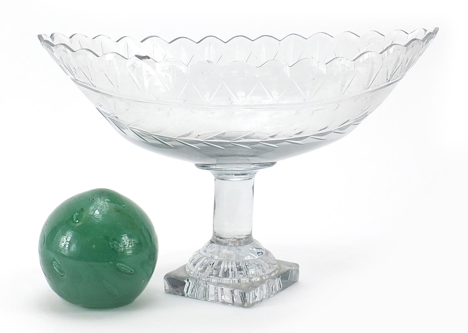 Late 18th/early 19th century cut glass pedestal centrepiece and a green glass dump weight, the