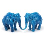 Pair of continental Majolica blue glazed elephants, each 18.5cm in length