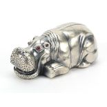 Silver hippopotamus paperweight with ruby eyes, impressed Russian marks to the base, 7.8cm in