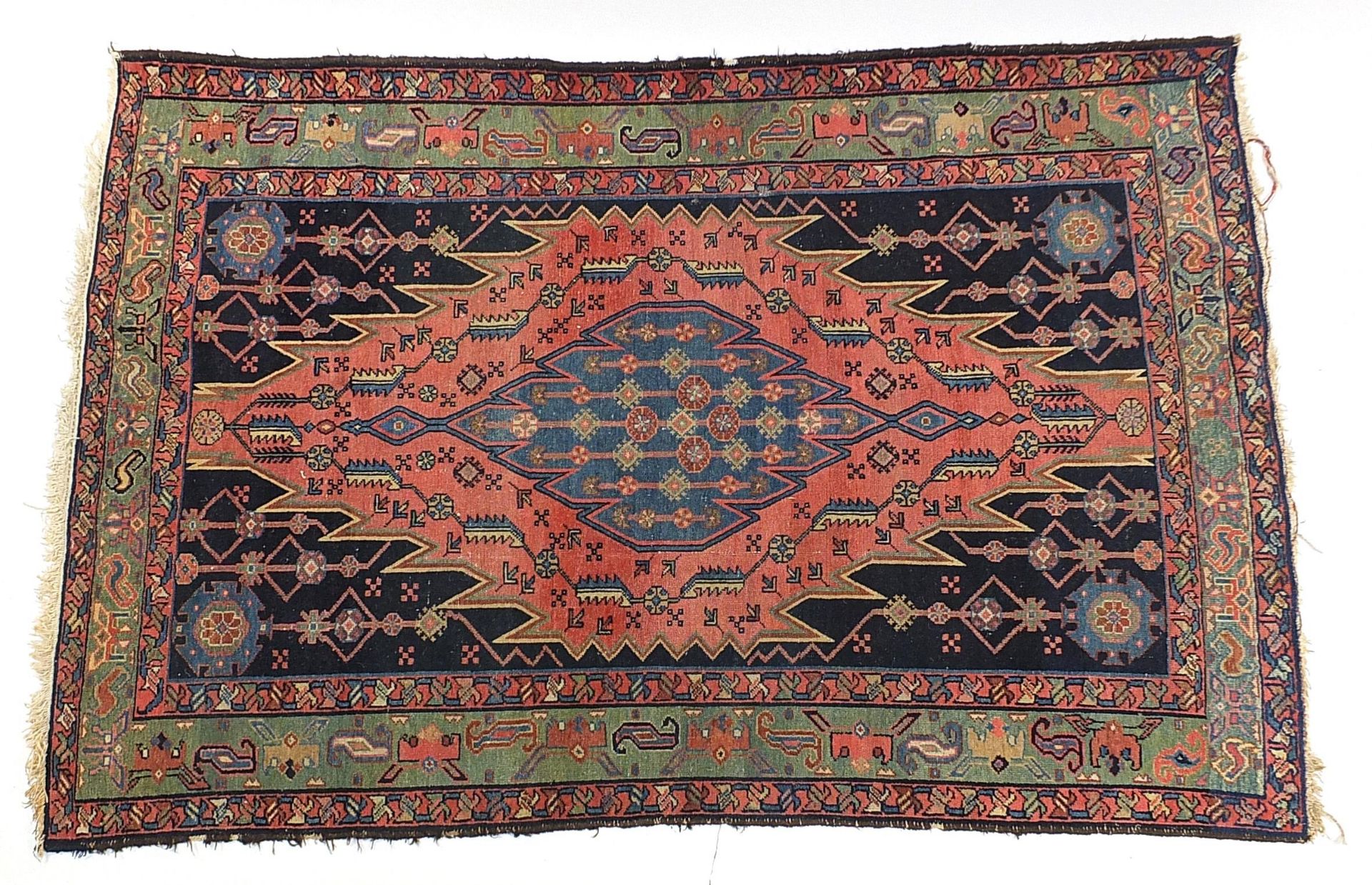 Red and blue ground rug with all over geometric design, 195cm x 130cm