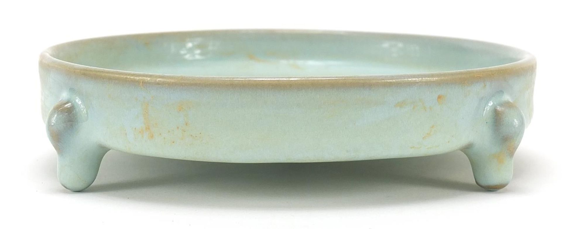 Chinese porcelain tripod censer having a celadon glaze, 14.5cm in diameter