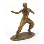 Patinated bronze figure of Bruce Lee, 35.5cm high