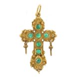Ornate 9ct gold cross pendant set with cabochon green stones, possibly emeralds, 4.0cm high, 6.5g