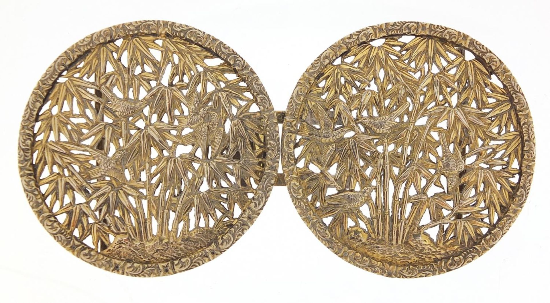 Chinese silver gilt two piece buckle, pierced and embossed with birds amongst bamboo grove, possibly