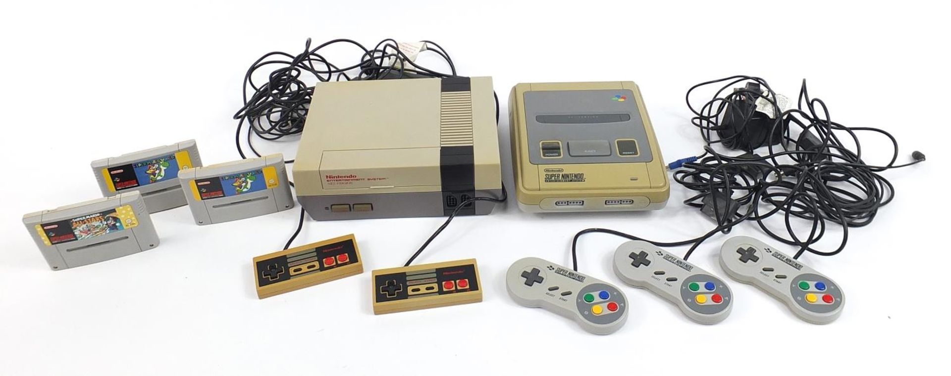 Vintage Nintendo NES games console with controllers and Super Nintendo games console with