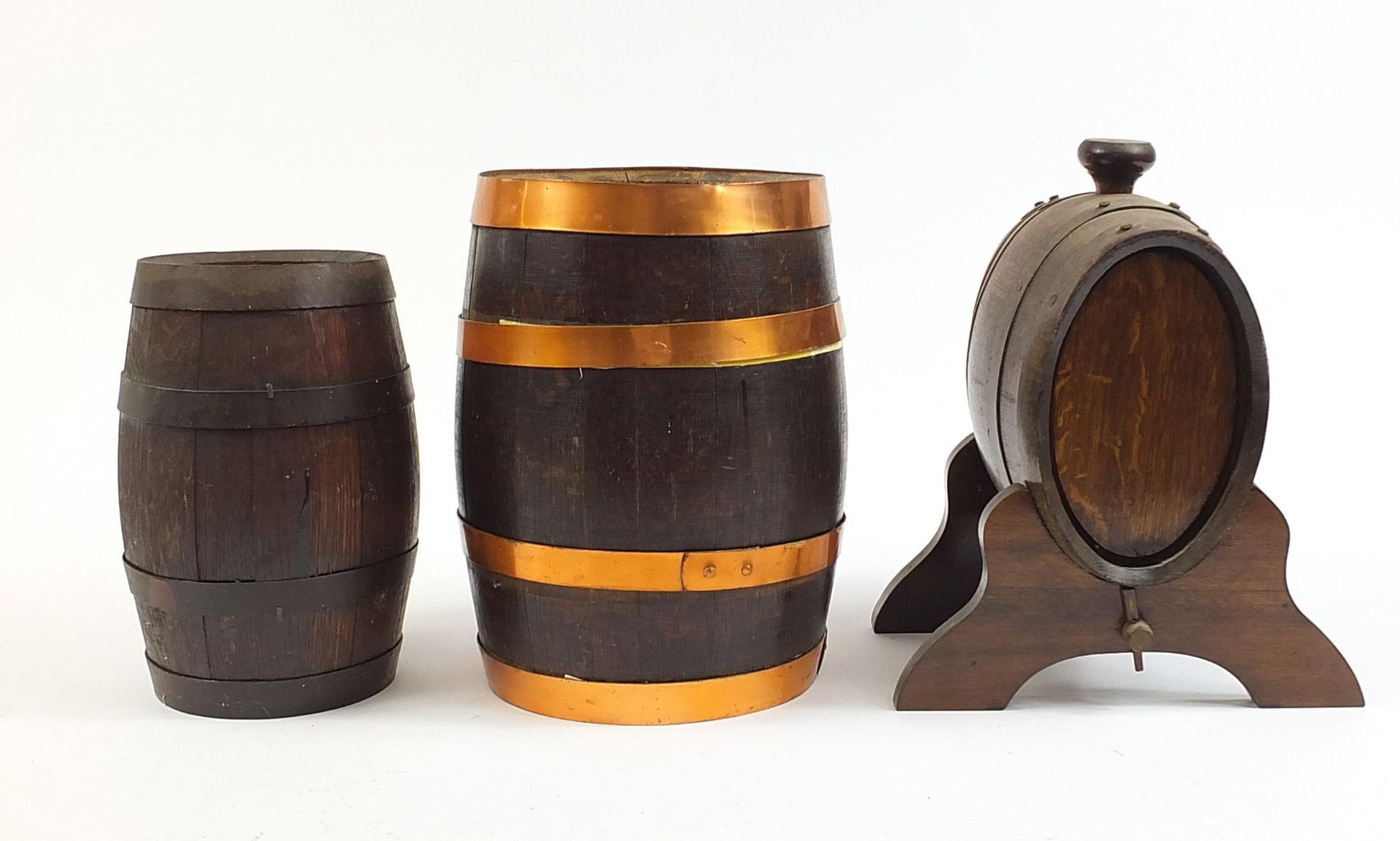 Three oak barrels with metal mounts including one on stand, the largest 35cm in length - Image 2 of 2