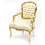 French style gilt framed open armchair with cream and gold upholstery, 91cm high