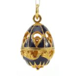 Russian gilt metal and enamel egg pendant with box, 2.8cm high, 6.8g