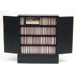 Collection of Mozart CD's housed in a black painted two door cupboard, the cupboard 75cm H x 62cm