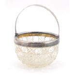 Edward VII cut glass basket with silver mount and swing handle, London 1906, 11cm in diameter