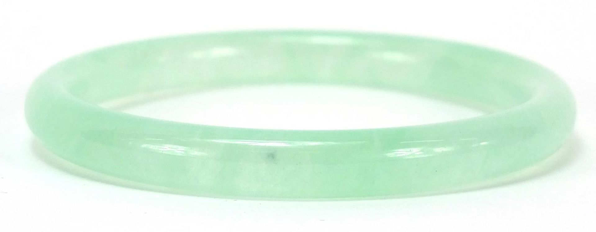 Chinese pale green jade bangle, 7.5cm in diameter, 27.0g - Image 2 of 2