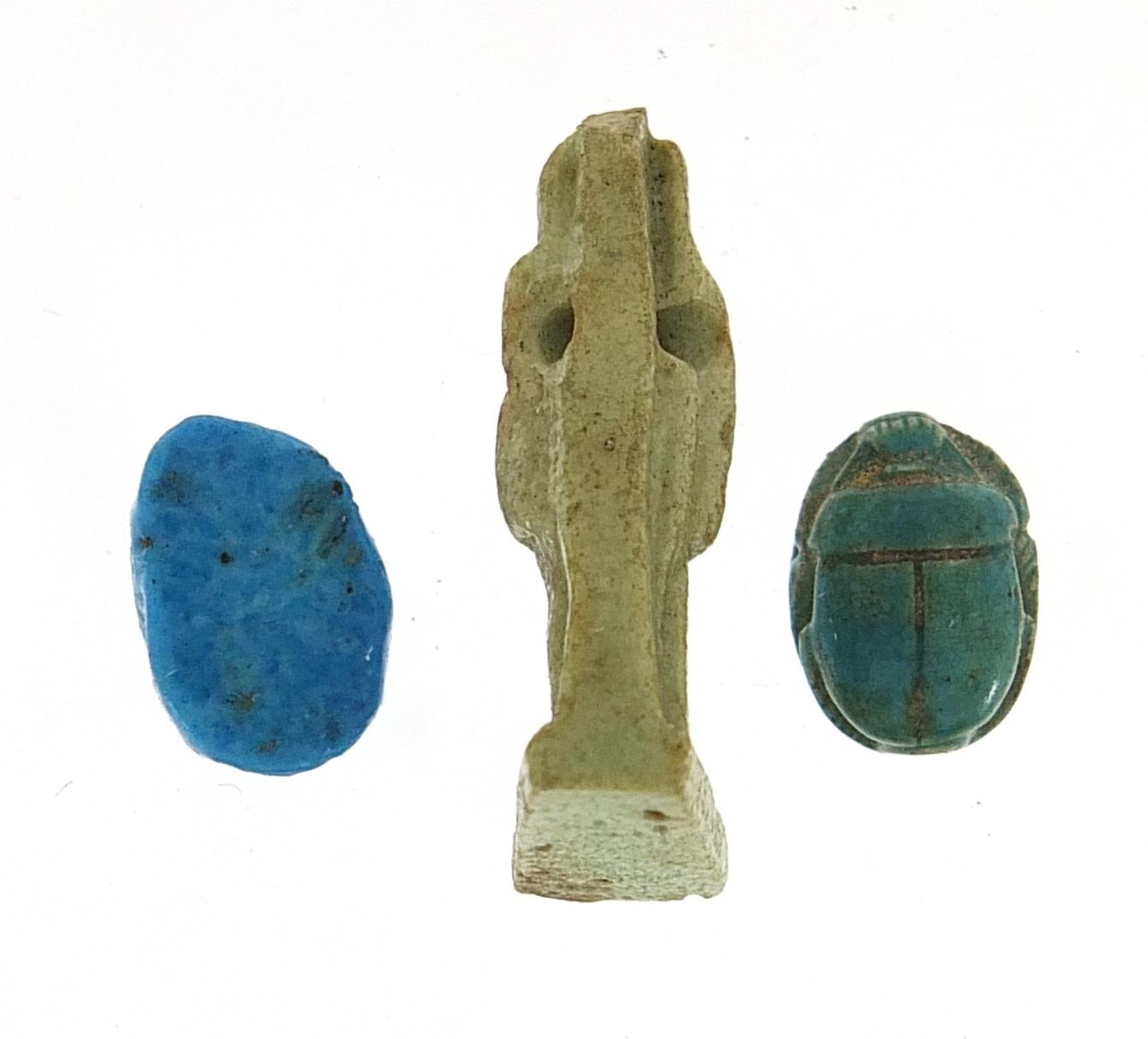 Two Egyptian faience glazed scarab beetle beads and an Isis amulet, the largest 2.5cm high - Image 2 of 2