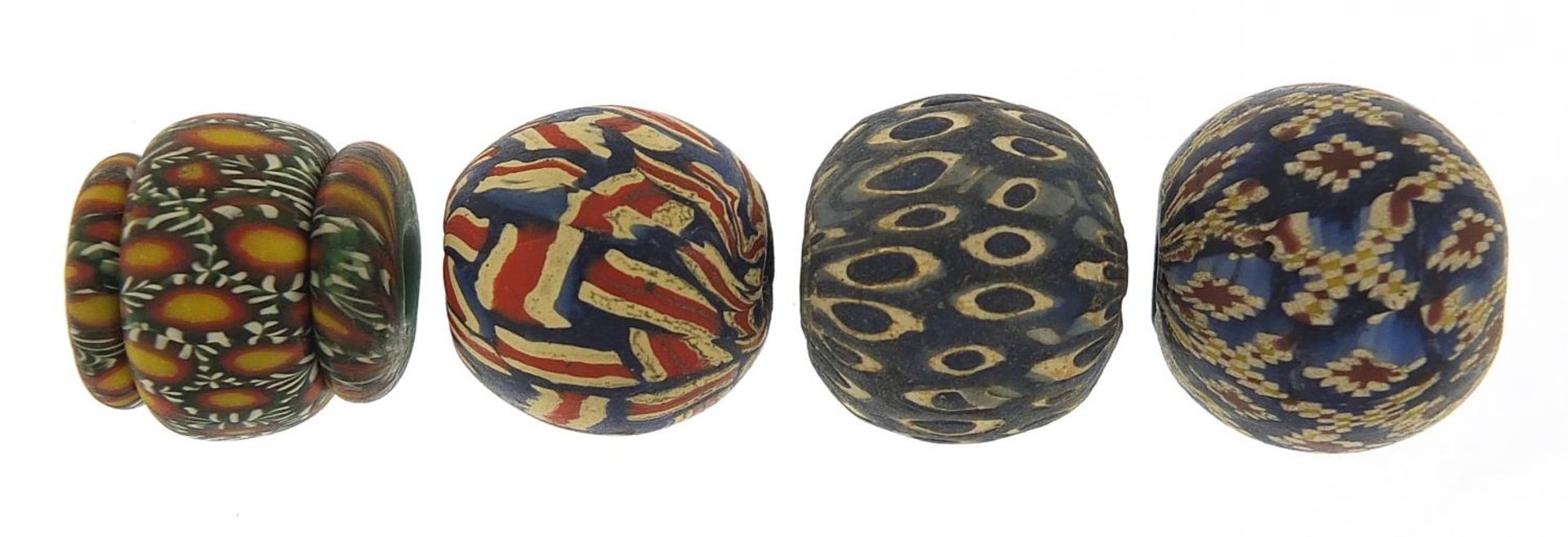 Four Islamic glass beads, each approximately 2cm high - Image 2 of 2