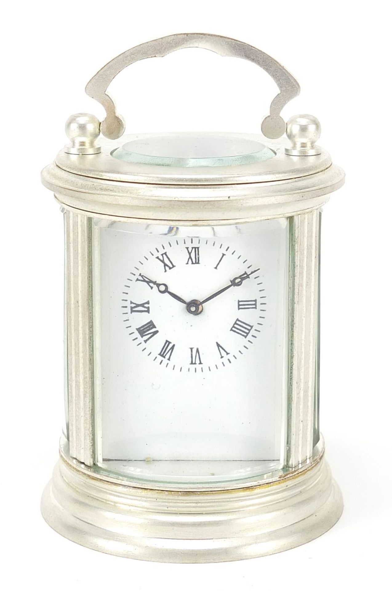 Miniature silvered cylindrical carriage clock with enamelled dial, 8cm high