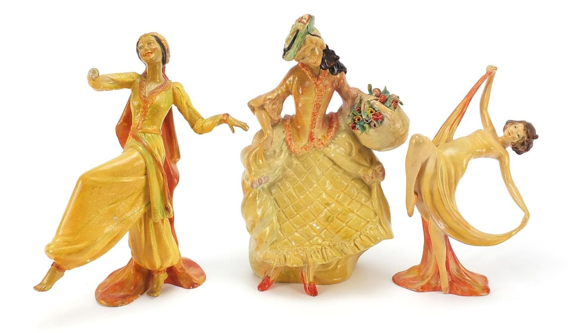 Three Wade cellulose figurines of Art Deco females, the largest 25.5cm high