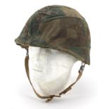 Military interest USM1 helmet with camouflage cover