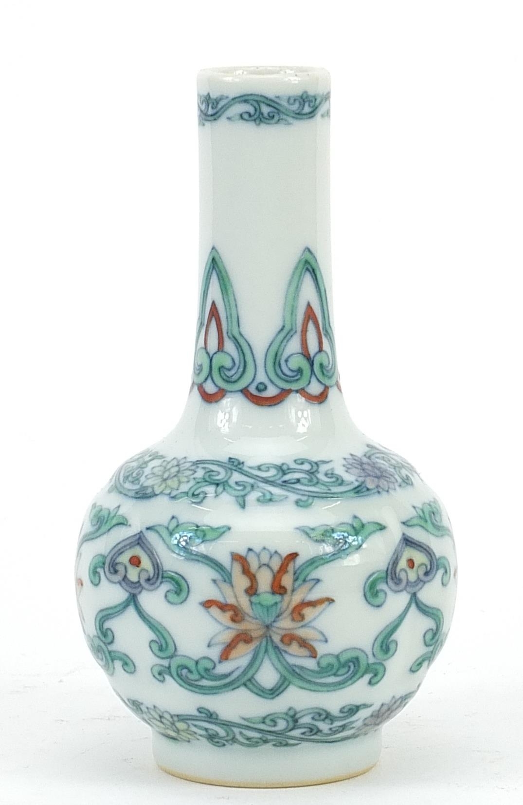 Chinese doucai porcelain vase hand painted with flower heads amongst scrolling foliage, six figure
