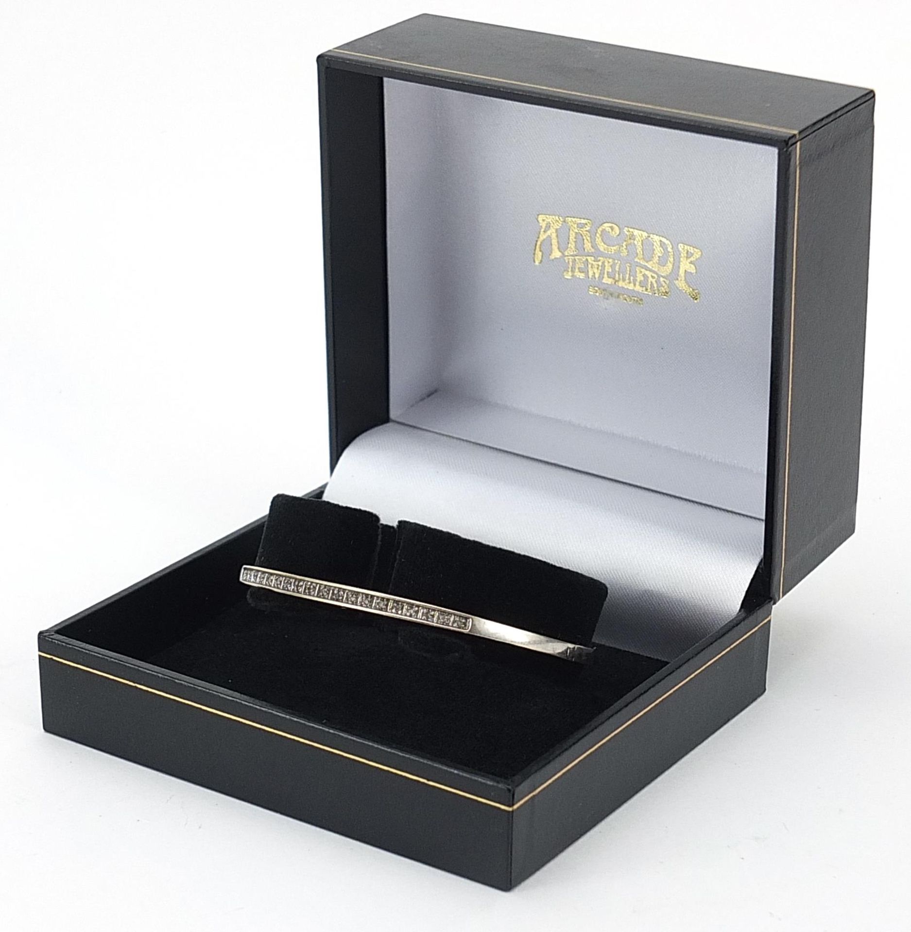 9ct white gold diamond hinged bangle housed in an Arcade Jewellers box, 6.2cm wide, 7.2g - Image 3 of 4