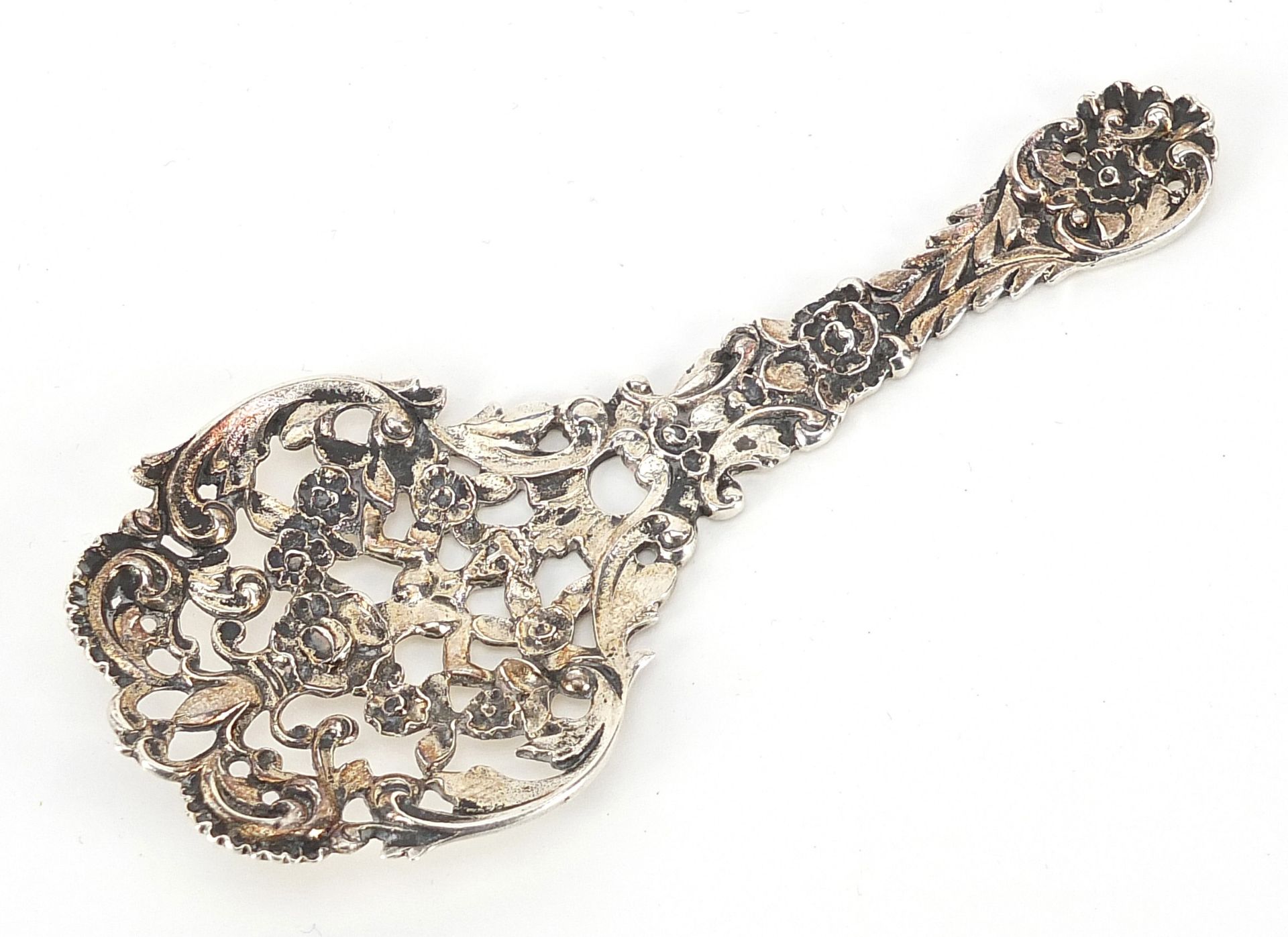 James Dixon & Sons Ltd, Victorian silver spoon pierced and embossed with a figure amongst flowers,
