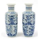 Pair of Chinese blue and white porcelain vases hand painted with panels of flowers, Kangxi blue ring