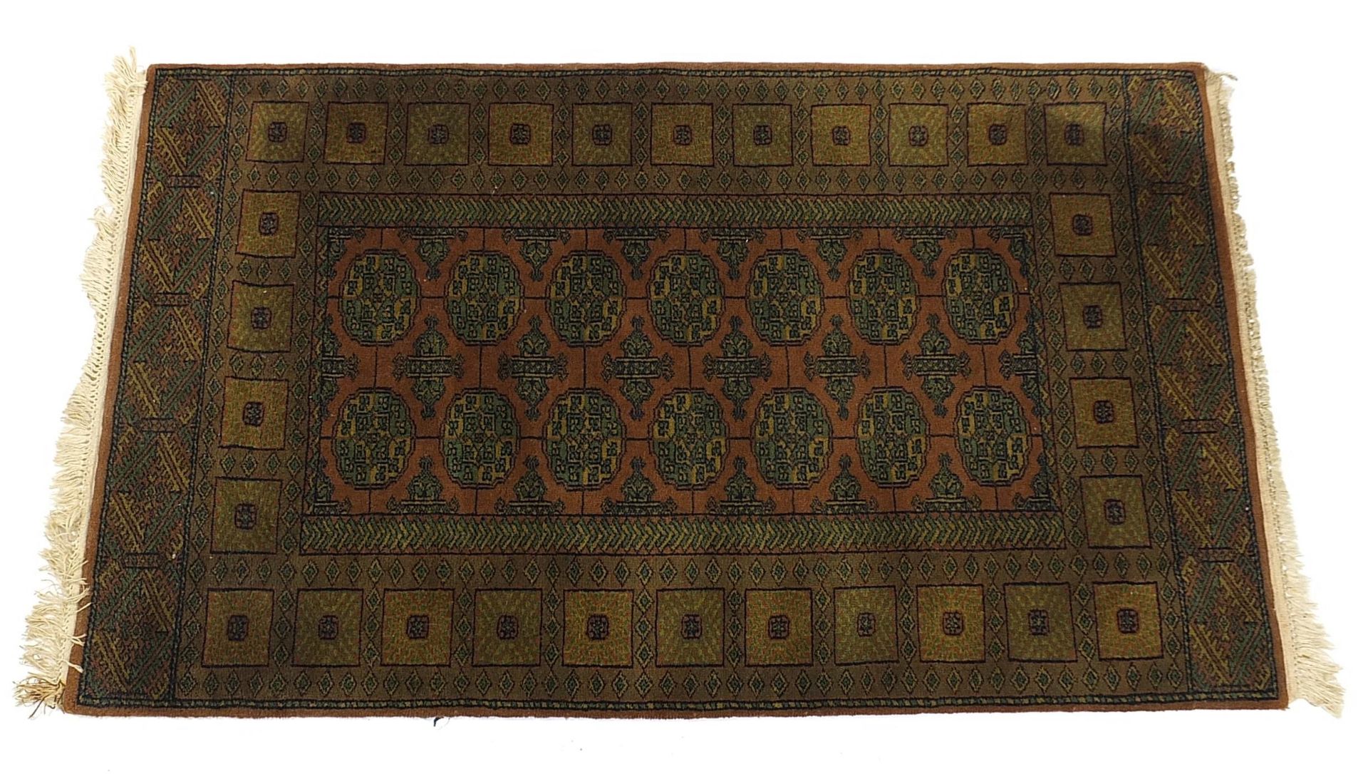 Middle Eastern green and brown ground rug with all over geometric design, 160cm x 95cm
