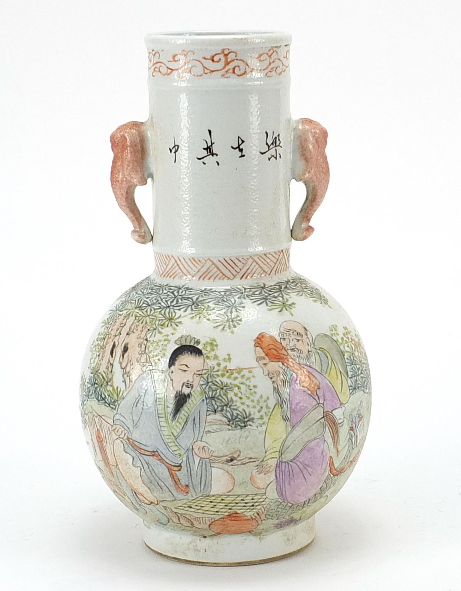Chinese porcelain vase with elephant head handles hand painted in the famille rose palette with