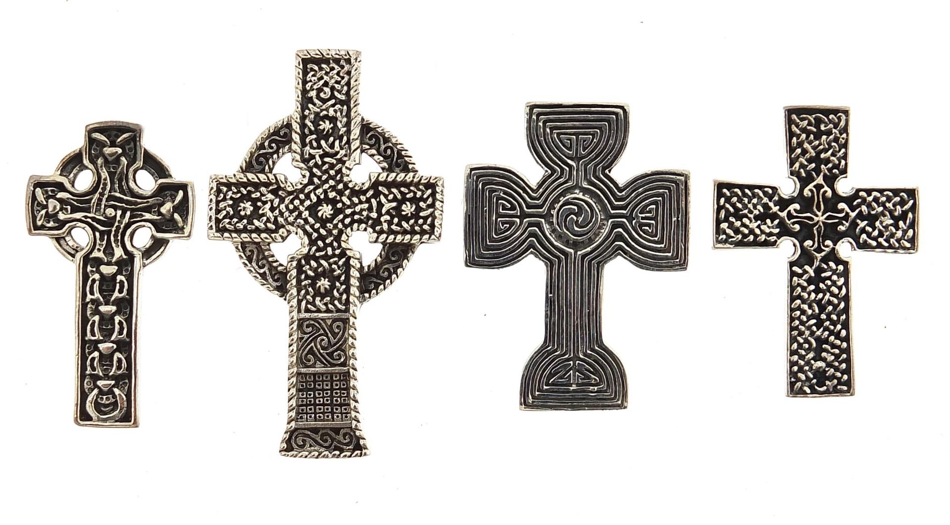 Four silver Celtic cross pendants, the largest 4.7cm high, total 30.4g