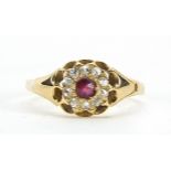 18ct gold ruby and diamond ring with pierced setting, size M, 2.4g