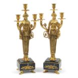 Large pair of French Empire style gilt bronze figural three branch candelabras raised on square