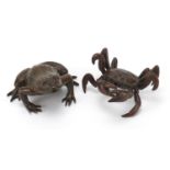 Two Japanese patinated bronze animals comprising frog and crab, each with impressed marks, the