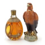 Bottle of Haig Dimple Scotch whiskey and a Beswick Golden Eagle decanter