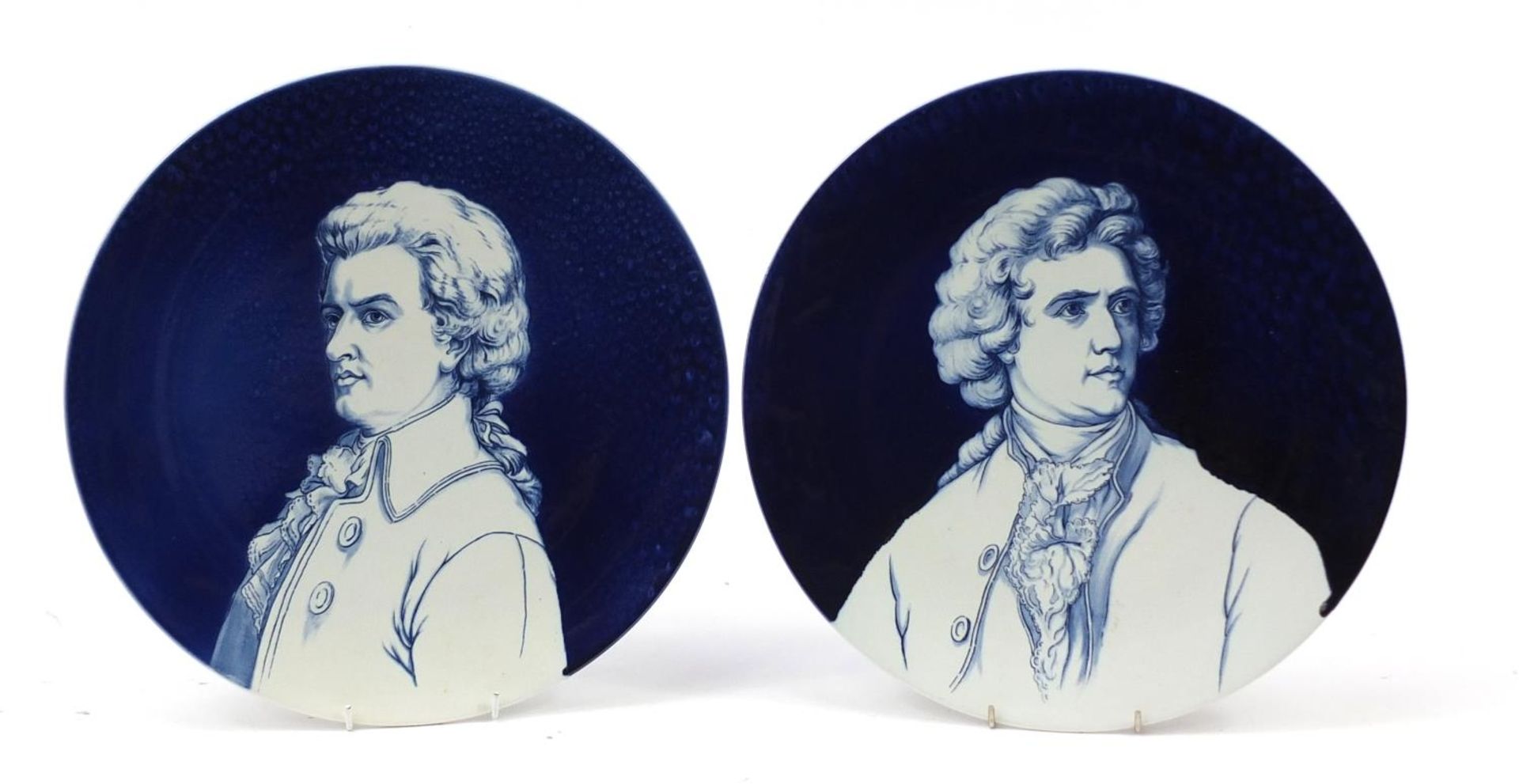 Pair of Villeroy & Boch pottery wall chargers hand painted with busts of Mozart and Goethe, 35cm