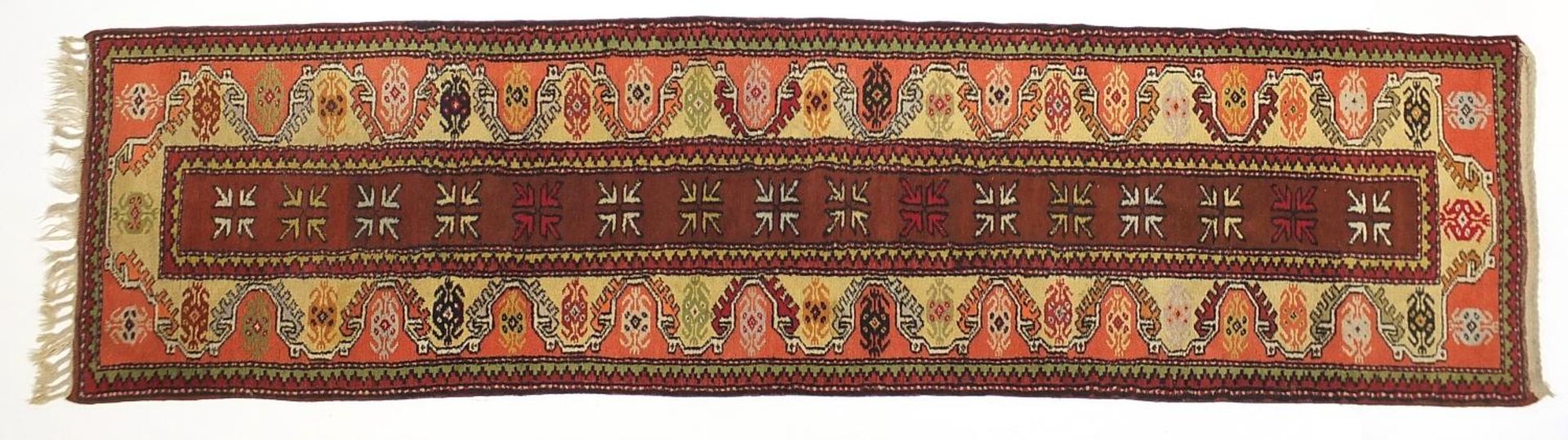 Rectangular Middle Eastern carpet runner having and all over geometric design, 275cm x 75cm