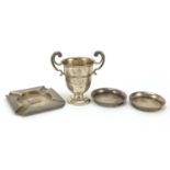 Silver objects comprising twin handled trophy, pair of circular dishes and ashtray, various