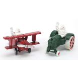 Painted cast iron Michelin style aeroplane and tractor, each 11cm in length