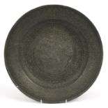 Islamic Persian bronze charger engraved with figures and calligraphy, 34.5cm in diameter