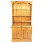 Pine dresser with open plate rack above two drawers and a pair of cupboard doors, 203cm H x 107cm