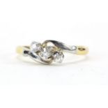 18ct gold diamond three stone crossover ring, size N/O, 2.7g