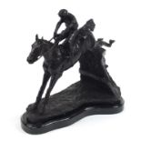 Large patinated bronze study of a jockey on horseback jumping a hurdle, 34cm in length