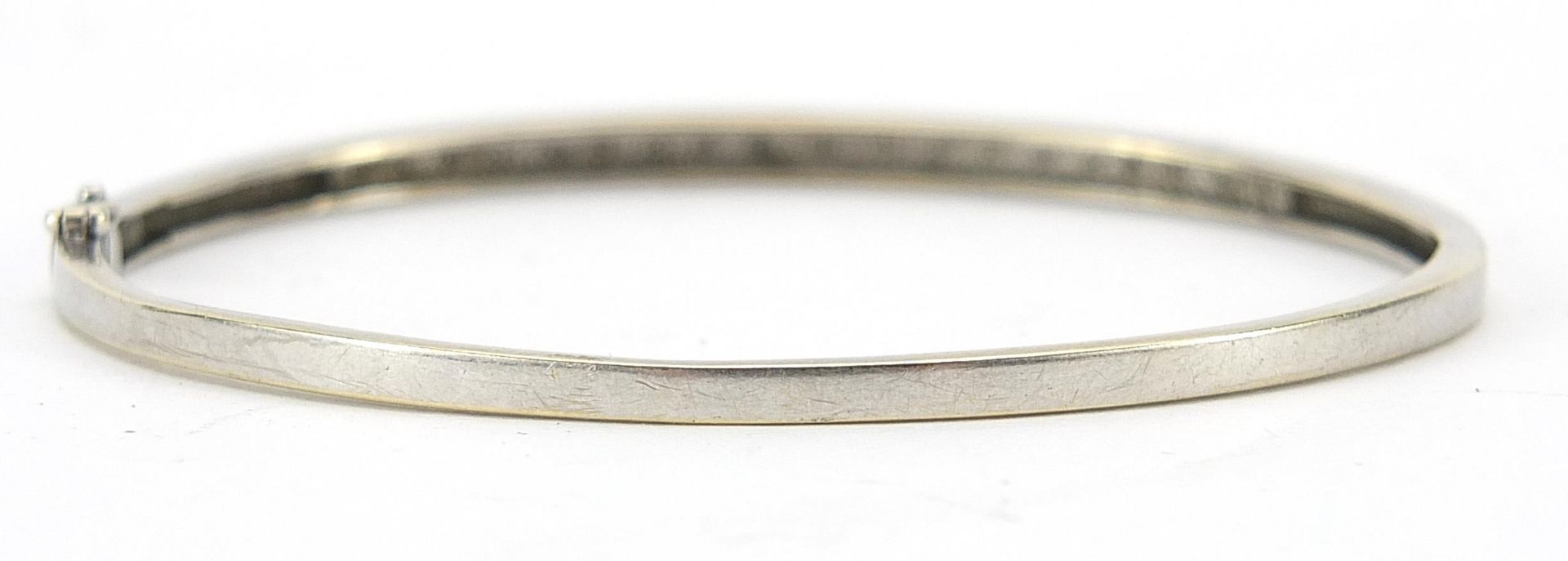 9ct white gold diamond hinged bangle housed in an Arcade Jewellers box, 6.2cm wide, 7.2g - Image 2 of 4