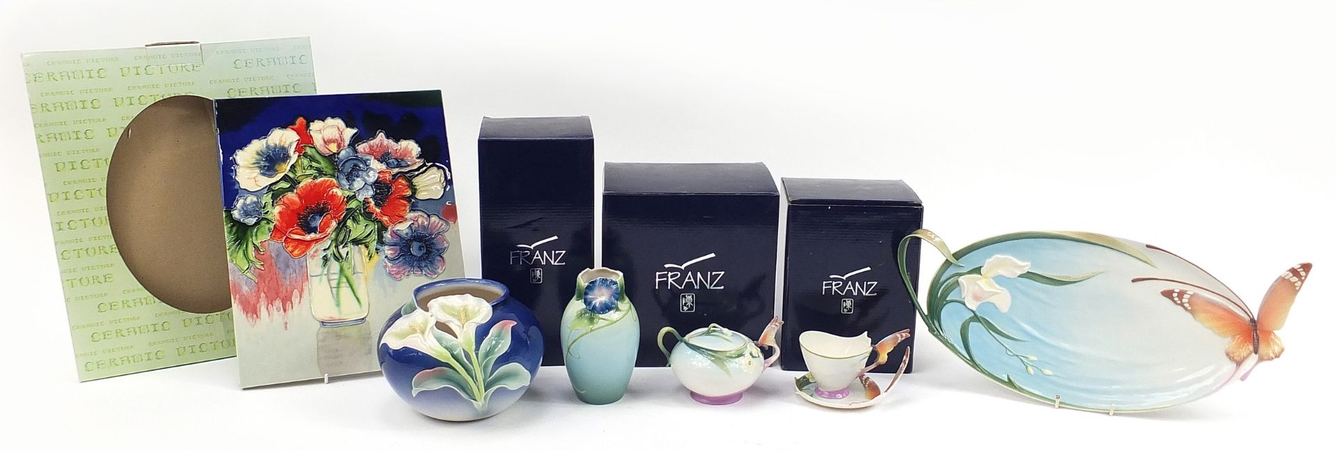 Franz porcelain and a Moorcroft style plaque, some with boxes including butterfly cup and saucer,