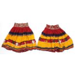 Two Middle Eastern or Indian mirrored embroidered skirts, possibly Banjara tribe, each 83cm high