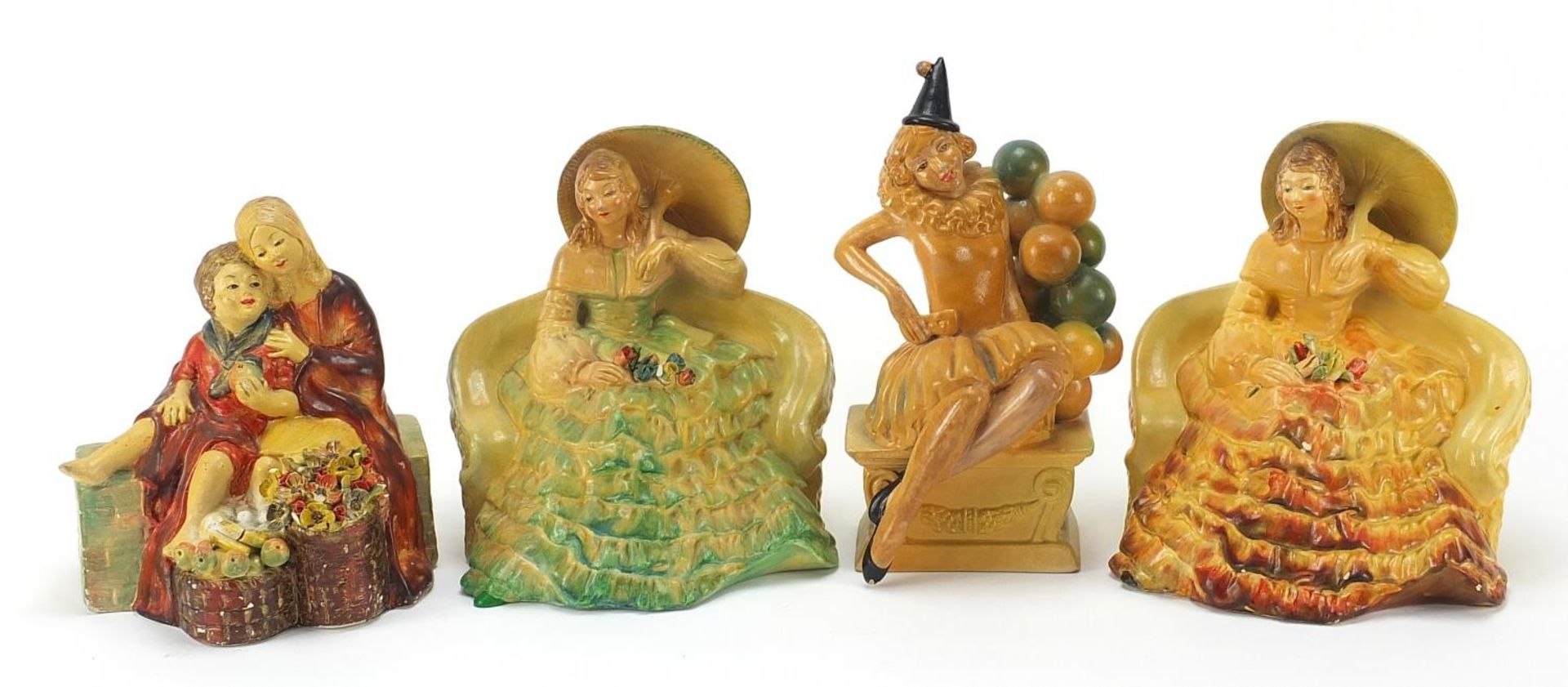 Four Wade cellulose figurines of Art Deco females, the largest 19cm high