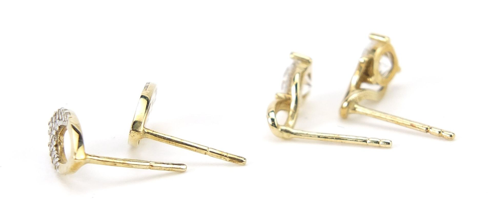 Two pairs of 9ct gold clear stone stud earrings, the largest 1.1cm high, total 2.1g - Image 2 of 3