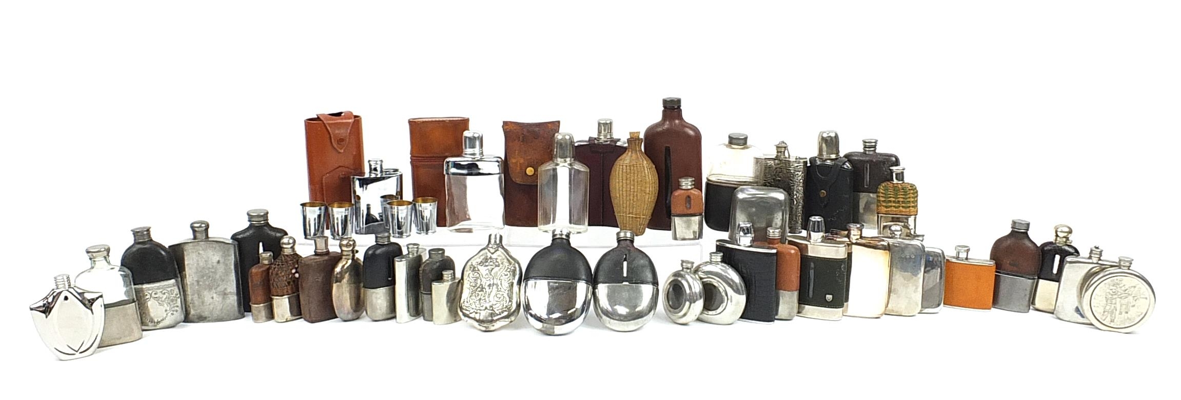 Large collection of antique and later hip flasks, the largest 20.5cm high