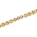Gold bracelet set with clear stones, indistinct marks to the clasp, (tests as 9ct gold) 21cm in