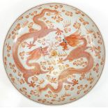 Large Chinese porcelain charger hand painted in iron red with two dragons chasing a flaming pearl