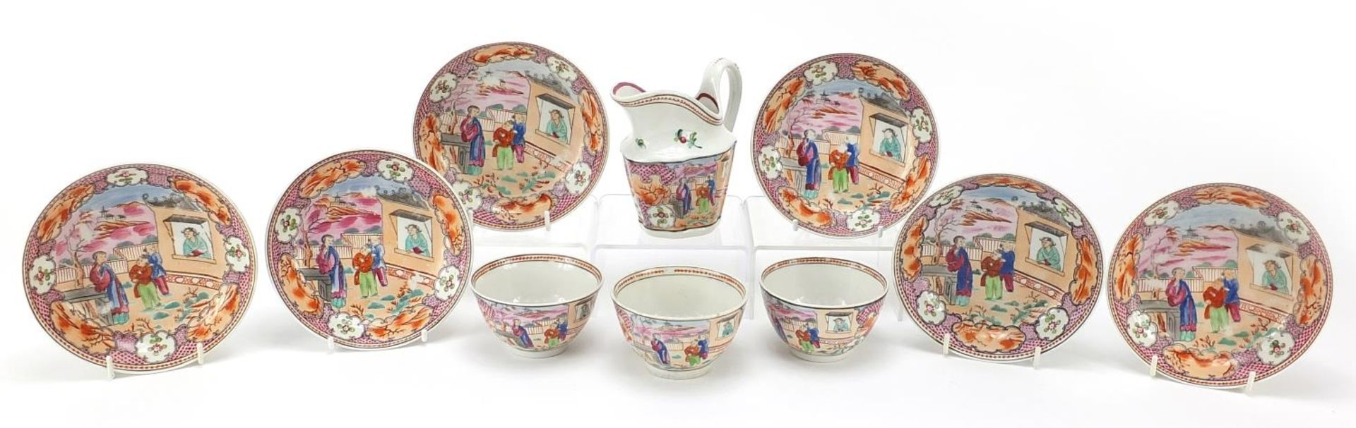 18th century Newhall teaware including a milk jug and saucers hand painted in the chinoiserie