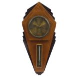 Art Deco carved oak wall barometer with thermometer, the circular dial impressed R A Jones & Sons of