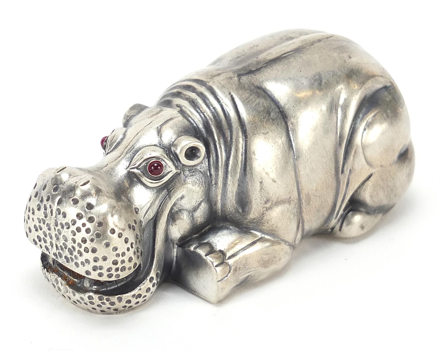Silver hippopotamus paperweight with ruby eyes, impressed Russian marks, 8cm in length, 71.0g